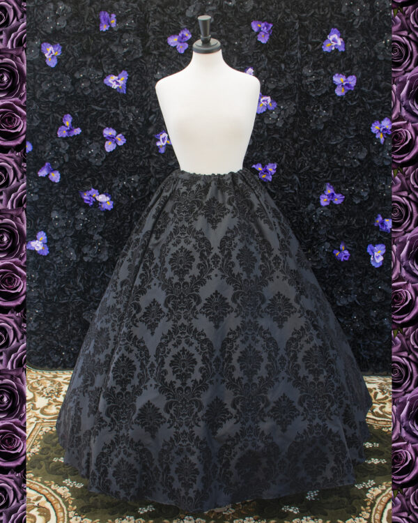 Black Flocked Taffeta Renaissance Skirt displayed on a mannequin over a hoopskirt