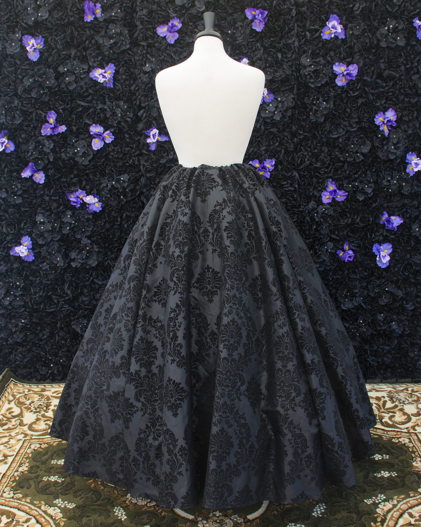 Black Flocked Taffeta Renaissance Skirt displayed on a mannequin over a hoopskirt