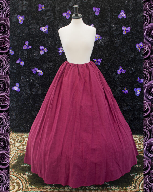 Burgundy Linen Renaissance Skirt displayed on a mannequin over a hoop skirt