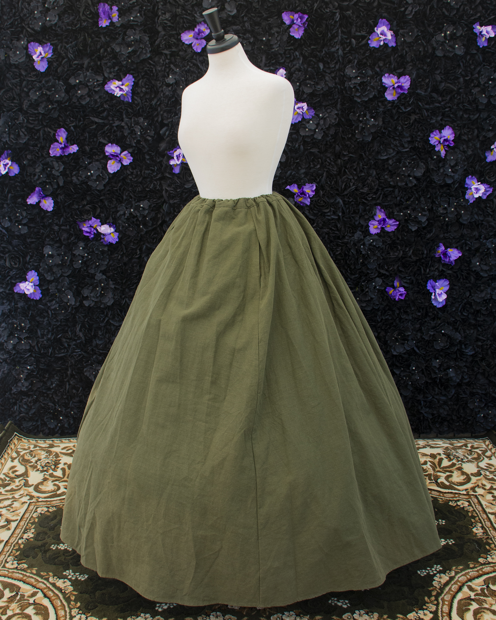 Dark Olive Green Linen Renaissance Skirt displayed on a mannequin over a hoop skirt
