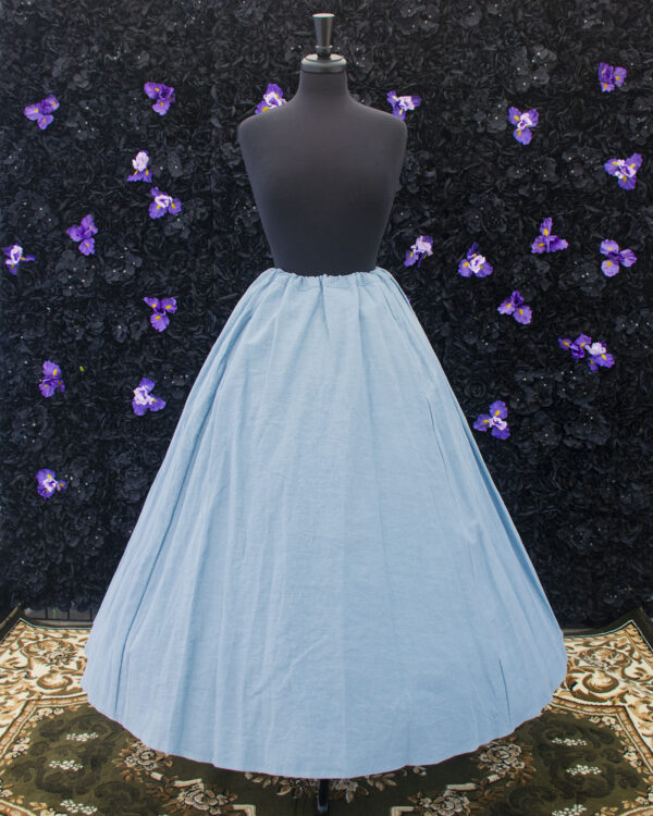 Pale Blue Linen Renaissance Skirt displayed on a mannequin over a hoop skirt