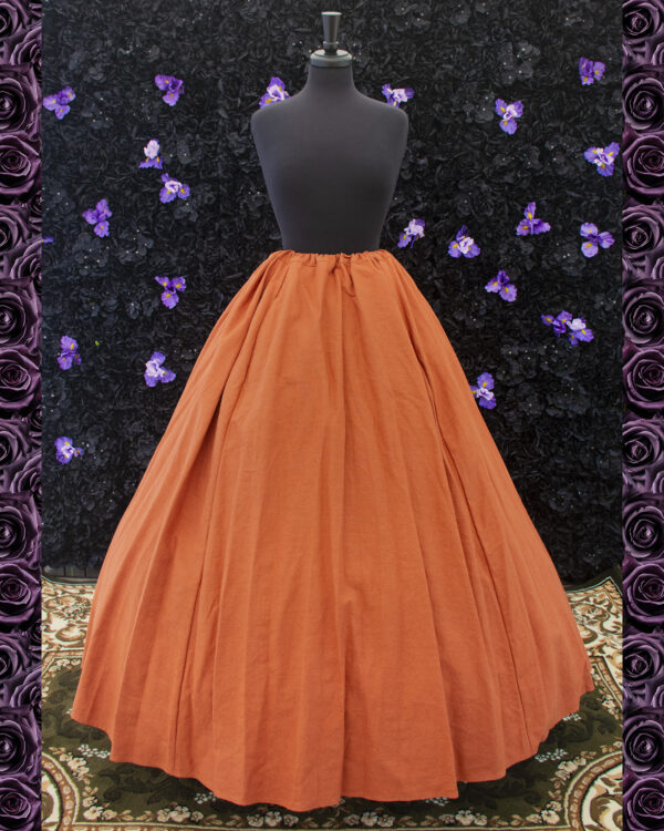 Rust Orange Linen Renaissance Skirt displayed on a mannequin over a hoop skirt