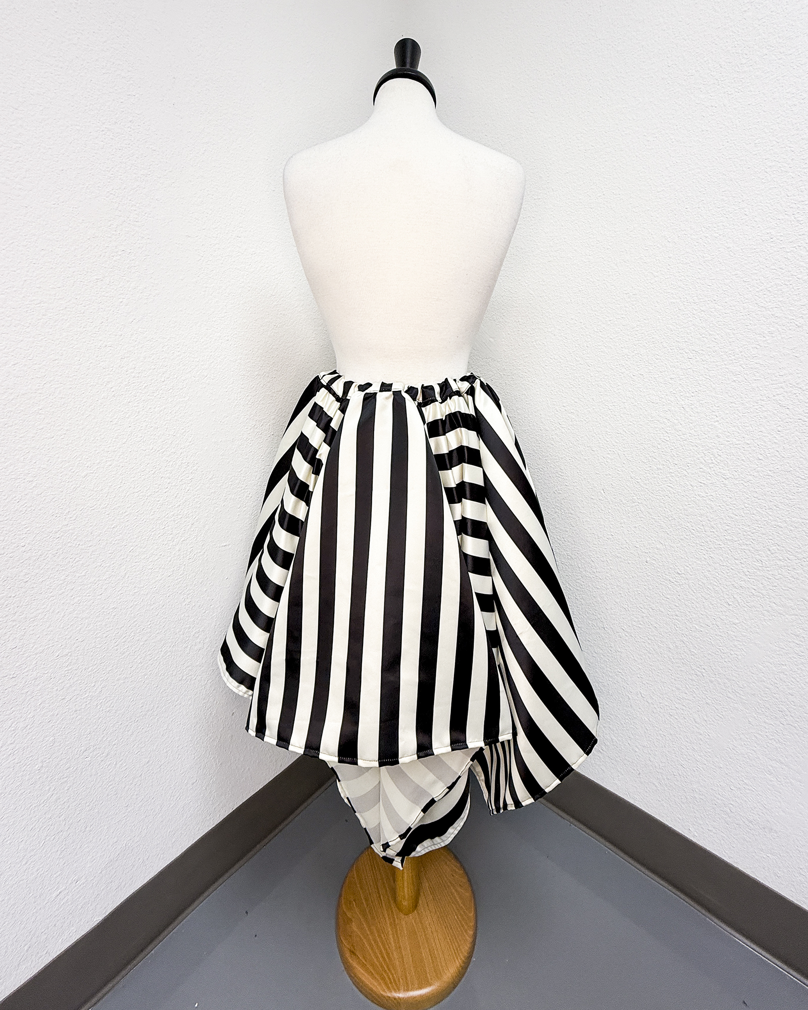 Ivory and Black Striped Satin Petal Skirt displayed on a mannequin