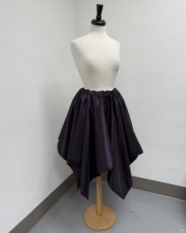 Bad picture of the Dark Purple Taffeta Petal Skirt displayed on a mannequin